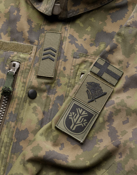 Varusteleka Finnlands M05 Einheitsabzeichen, Gedämpft