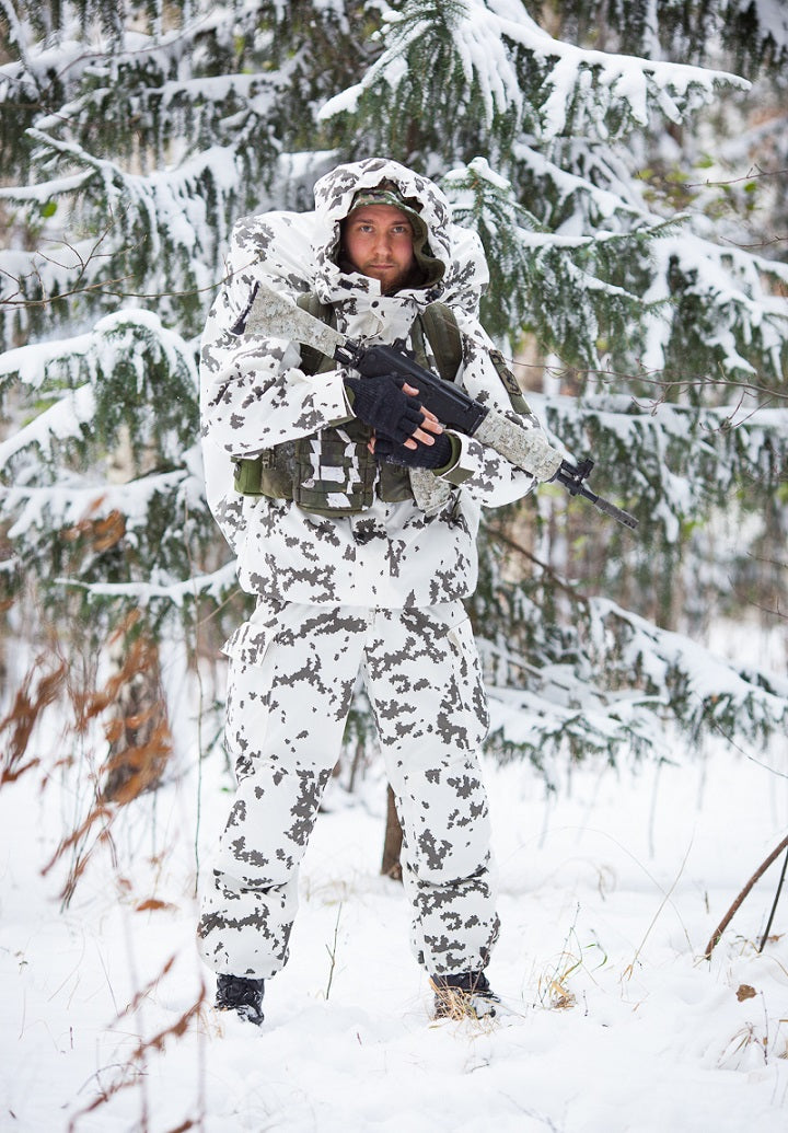 Snow wrap on the vest; reversed Woodland Digital on the rifle.