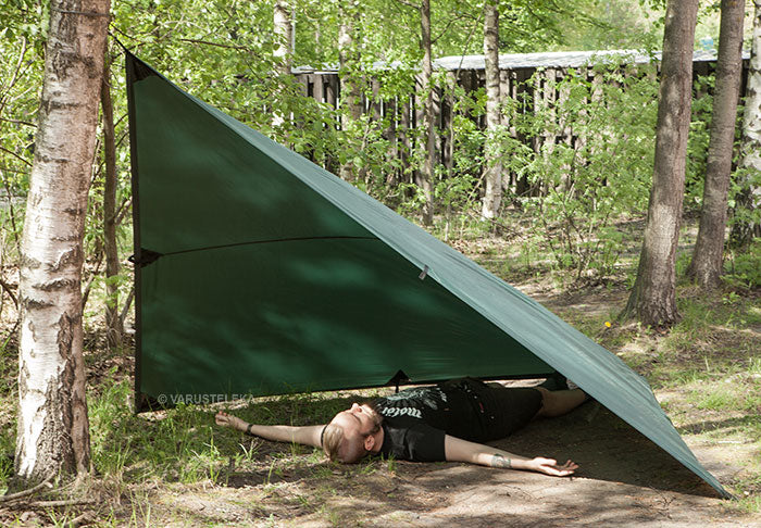 Pitched as a loue (Finnish term) the tarp nicely covers one happy camper.