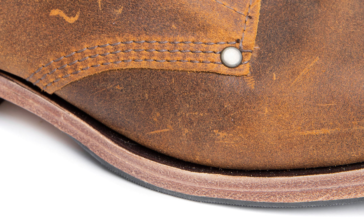 Blake construction; triple stitching with brass rivets.