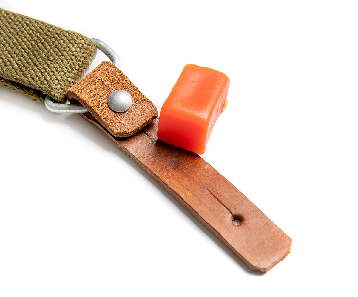 No matter what color the wax is; it won't color the leather.