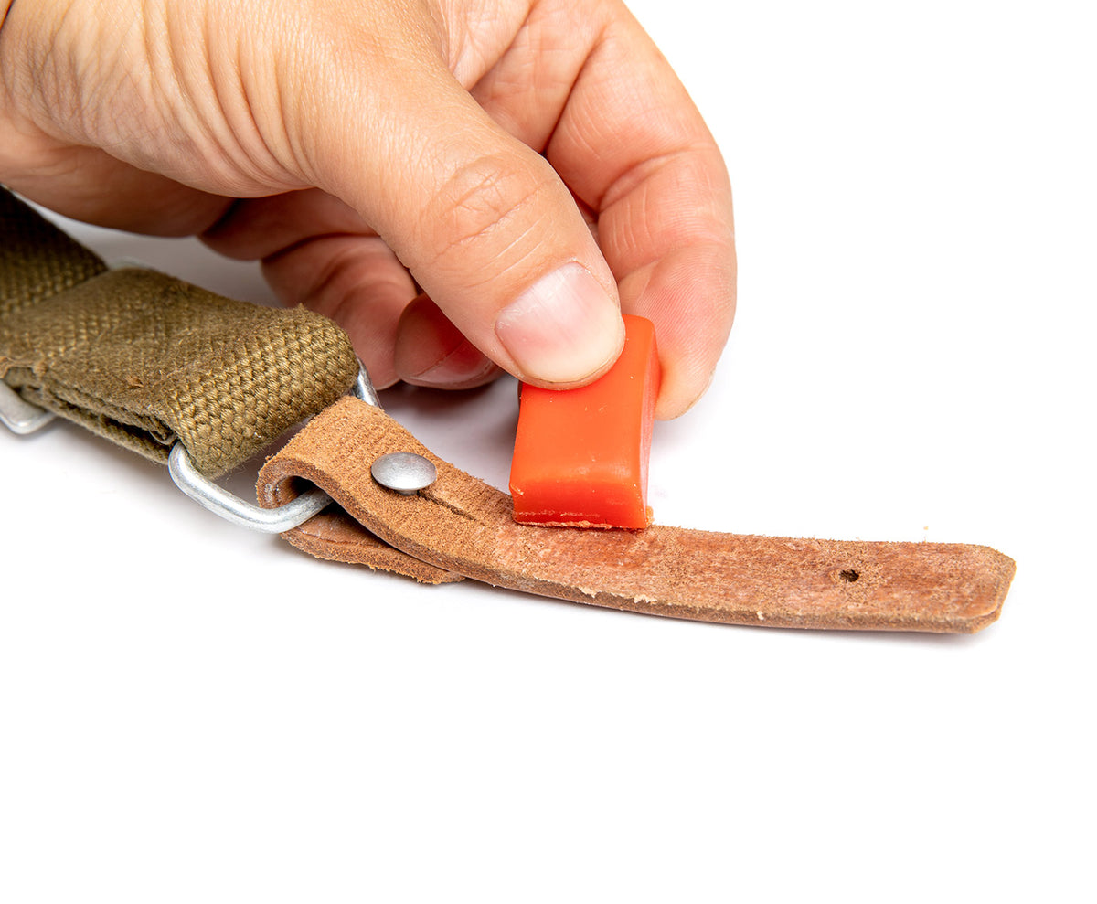 Rub the wax onto the outside of the leather.