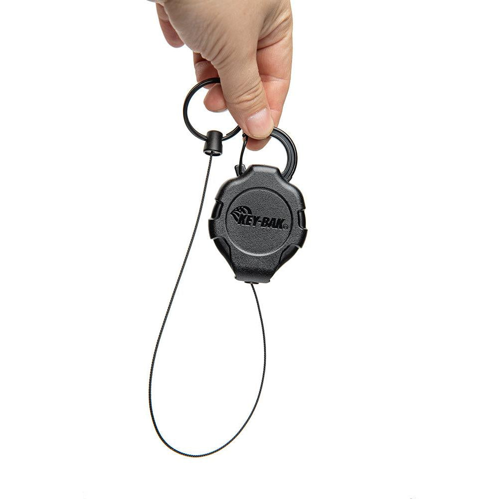The ratcheting function locks the cord in place. Give it a tug; and it reels back in.