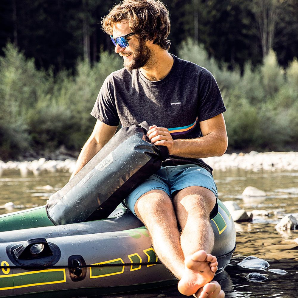 The sizes are larger than you'd expect. This is the second-smallest 22-liter model; and the guy in the picture is a human; not a hobbit.