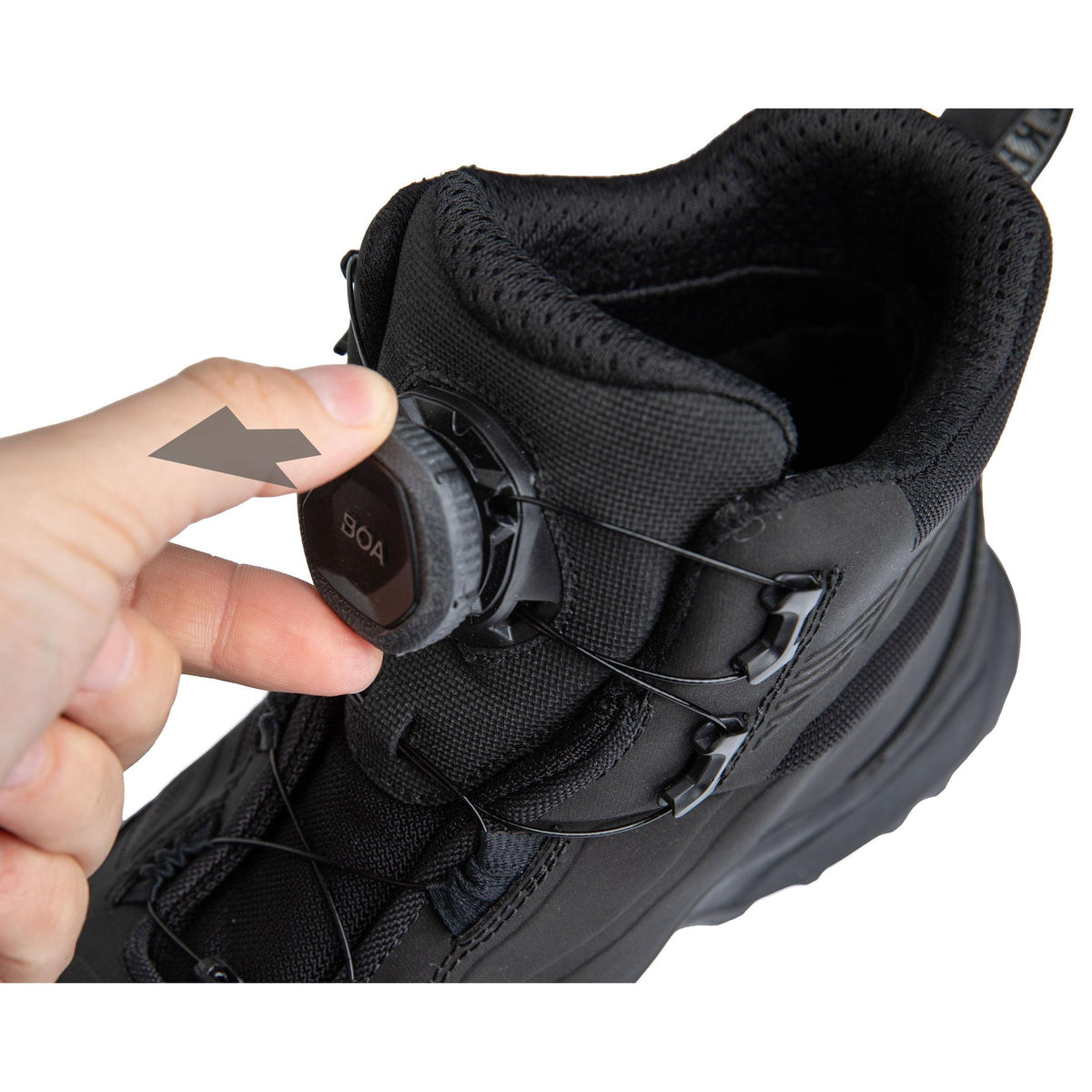 Loosen the laces by pulling the adjustment knob.