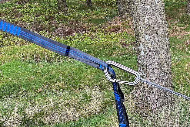 Connect your hammock via karabiner to any of the 14 loops on the strap. Karabiners must be purchased separately.