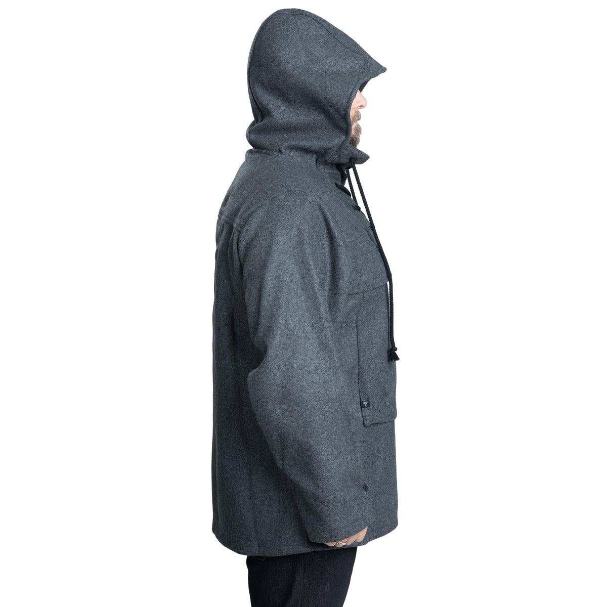 The same model wearing the size Small/medium. Fits nicely but doesn't allow thick mid-layers.