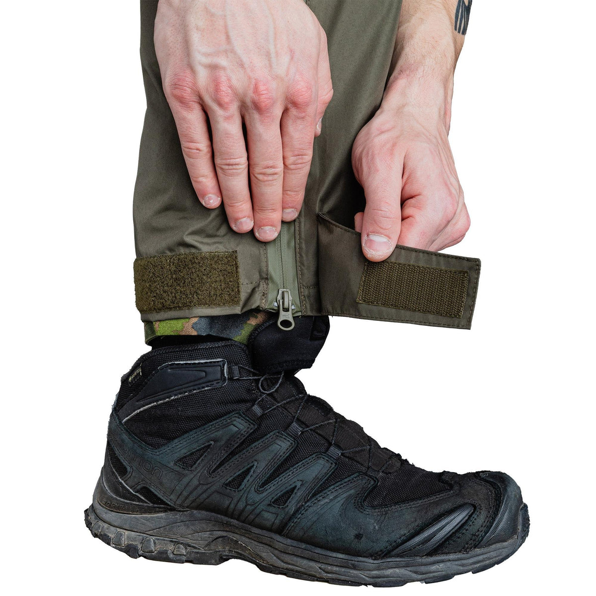 Pant cuffs have hook & loop adjustment.
